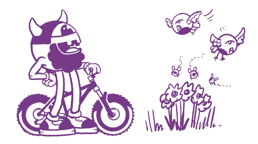 Huck stops his bike ride to admire two birds and some bees flying around some flowers