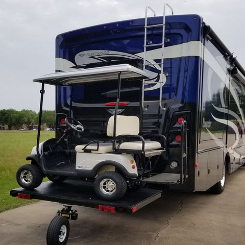 rv trailer towing a golf cart 