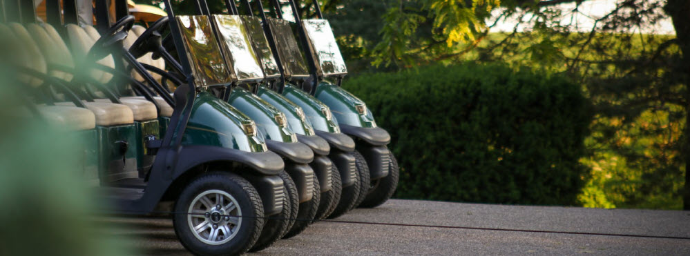 golf carts parked banner