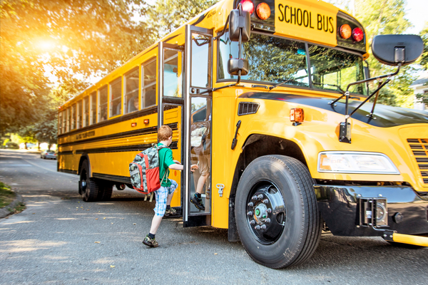 School bus with child boarding