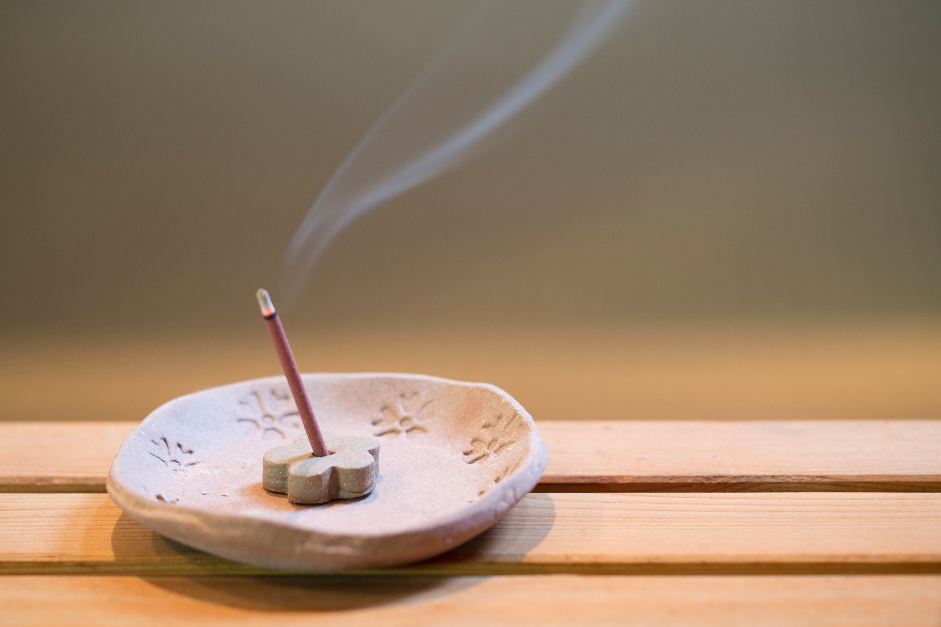 incense burning in a stone incense holder