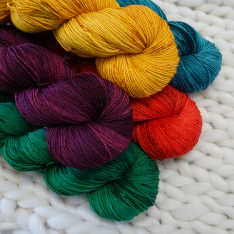 hand dyed yarn colors blue mustard green plum scarlet teal