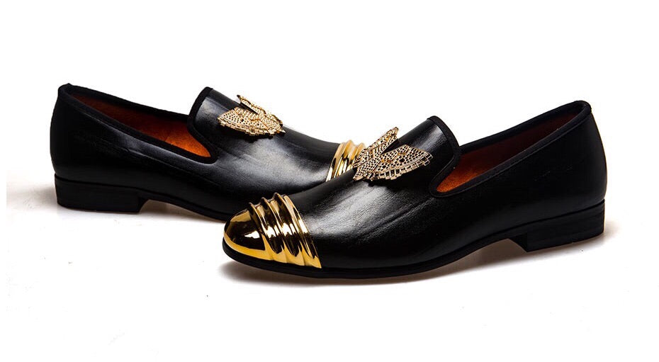 black leather loafers with gold buckle