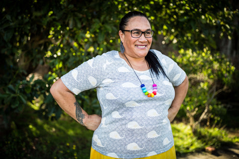 A babe in a cotton plus size t-shirt with a whale print