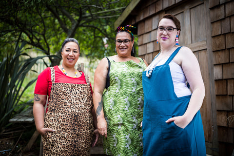 three fat babes in plus size cotton pinafore dresses in leopard print, leaf print and teal