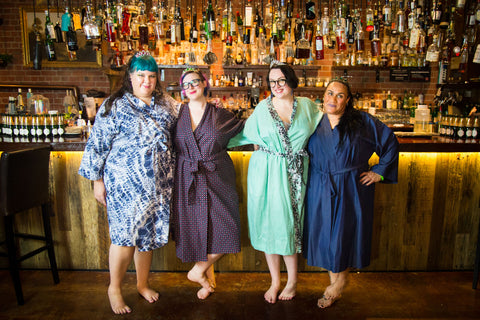 four girls in plus size robes