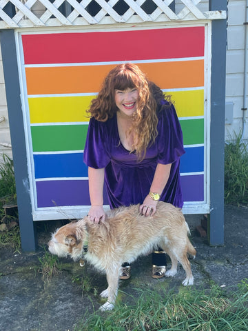 Rebecca wears the purple velvet YOU dress. Trixie Dog not included