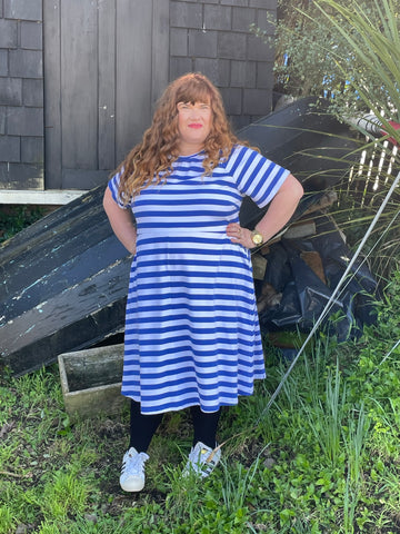 Rebecca wears a blue and white striped KRIS dress