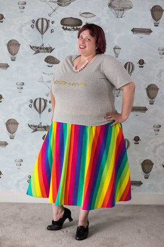 Carma in a rainbow cotton skirt with pockets