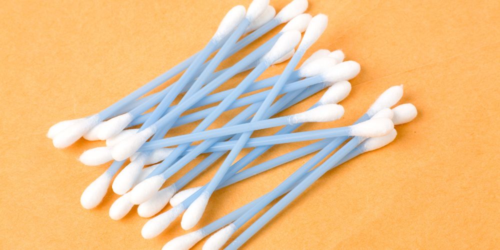 Traditional cotton buds with plastic stem