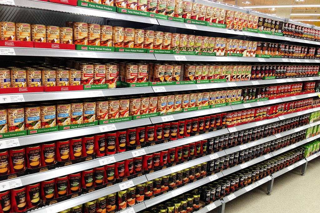 Canned Goods on Grocery Store Shelves