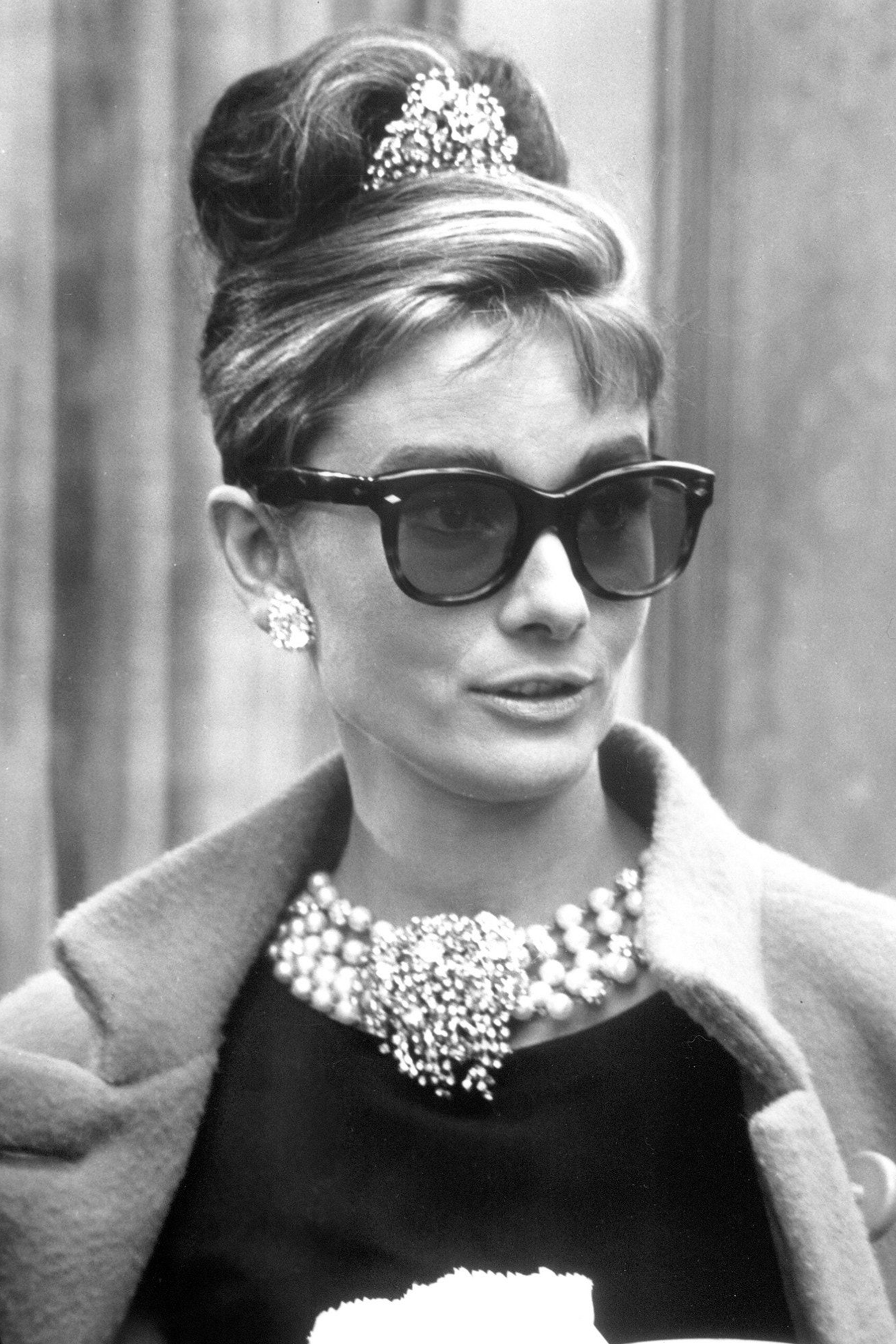 Audrey Hepburn wearing cat eye sunglasses