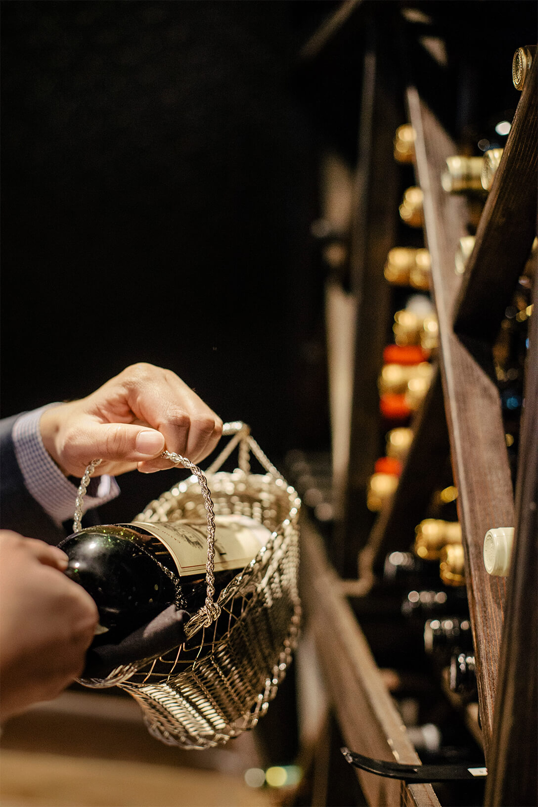 bottle of wine being prepared to serve