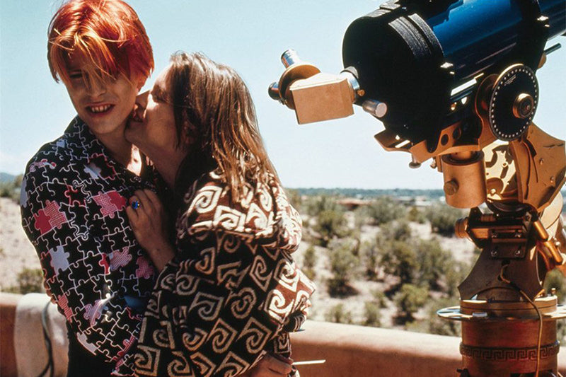 David Bowie hugging a woman