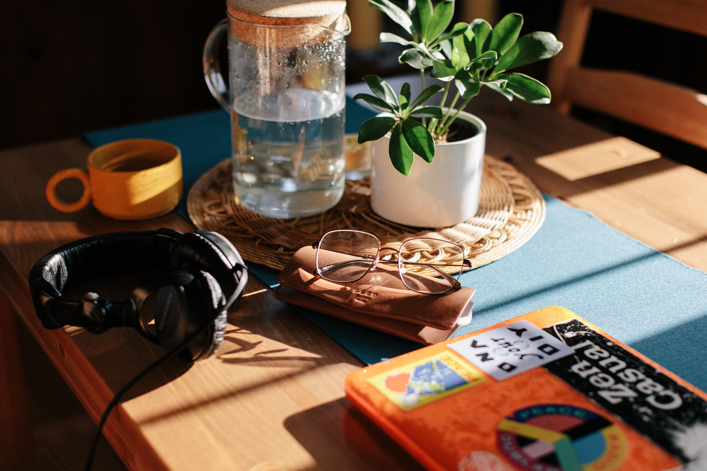 Close up image of Dr. Yewande's dining room table featuring Garrett Leight California Optical eyeglasses