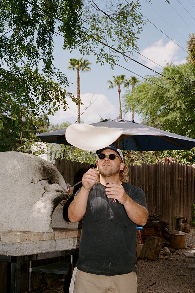 Kevin Hockin throwing pizza dough