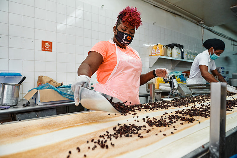 Allan's Bakery employee making bread