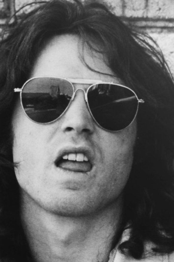 photo of Jim Morrison wearing aviator sunglasses