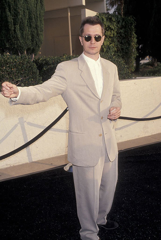 Gary Oldman wearing sunglasses on red carpet