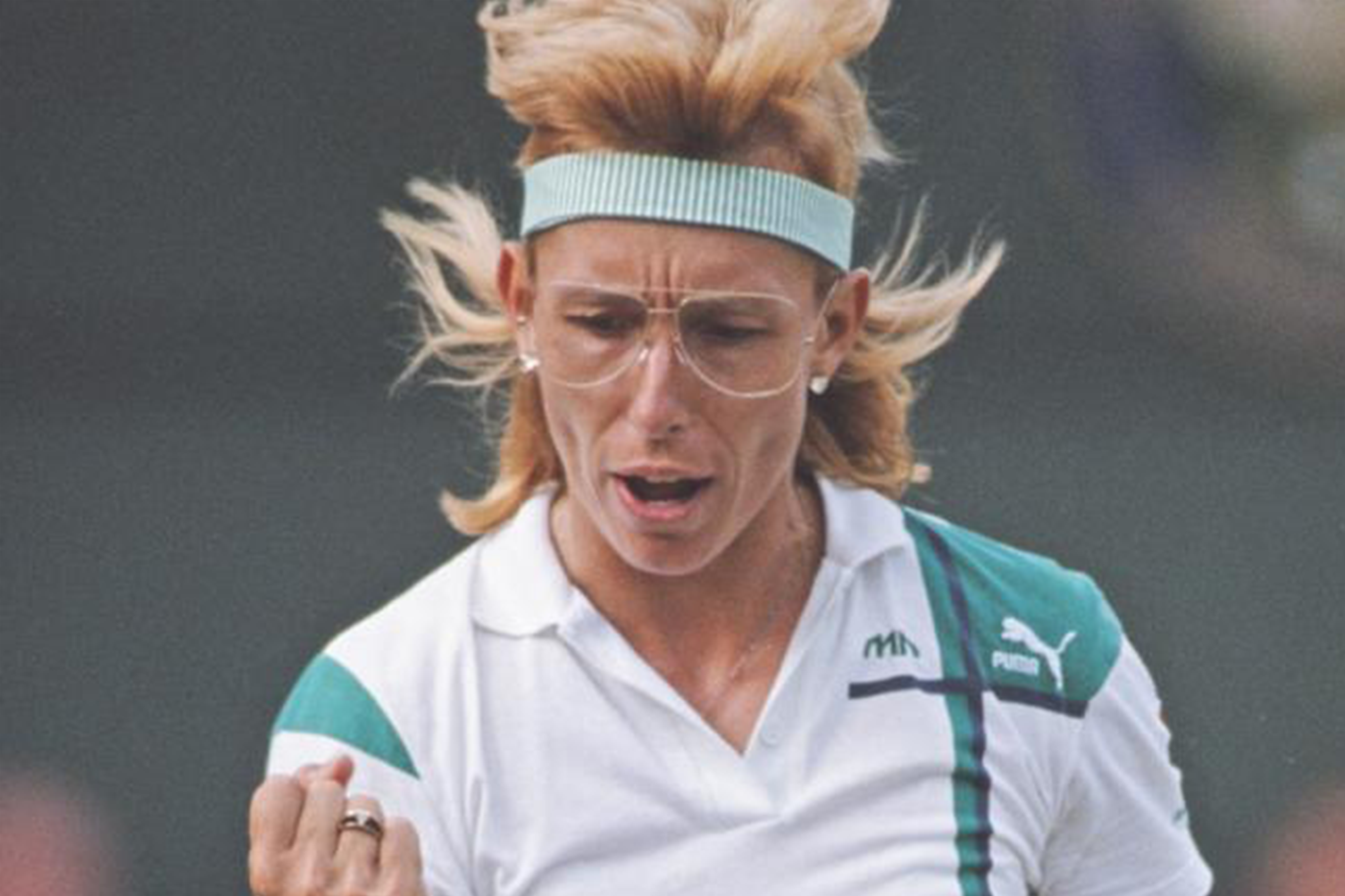 Martina Navratilova during a tennis match wearing her signature round frames