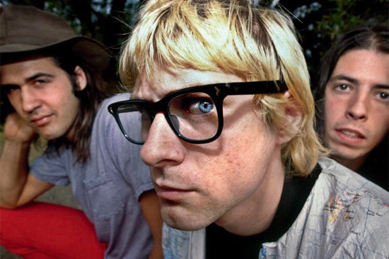 Kurt Cobain wearing chunky, rectangular eyeglasses