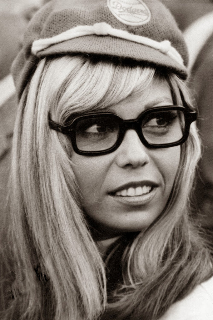 Nancy Sinatra wearing rectangular sunglasses