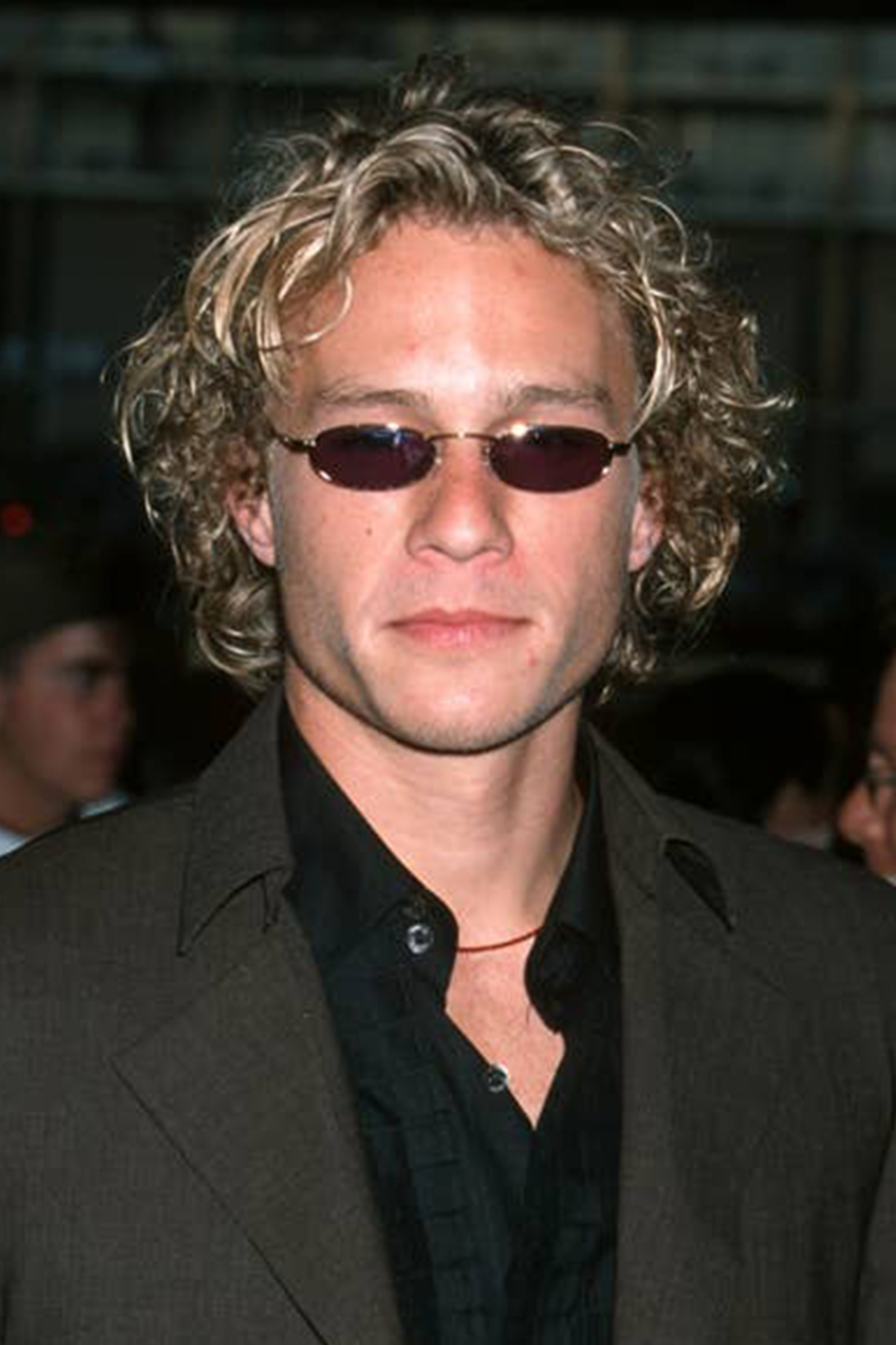 Actor Heath Ledger wearing 90s style small frame sunglasses