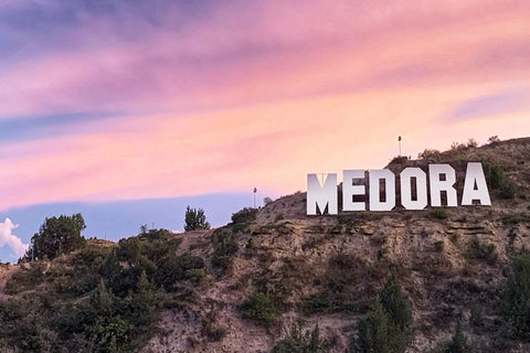 Theodore Roosevelt National Park Medora Sign On Hill With Sunset