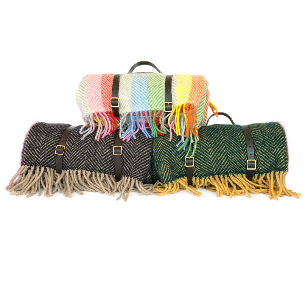 Three wool picnic blankets with waterproof backing and leather straps