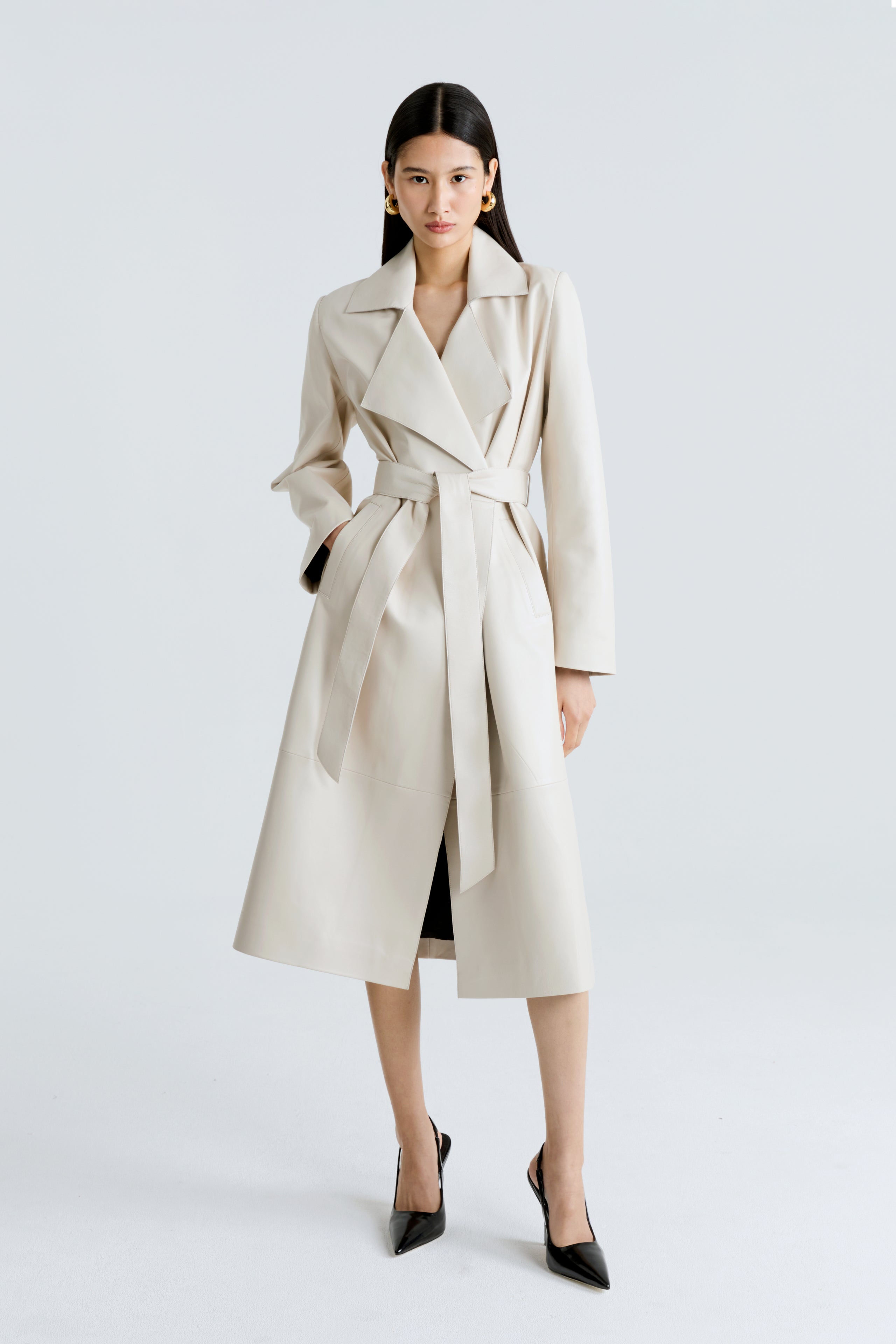 Model is wearing the Amina Ivory Belted Leather Coat Front