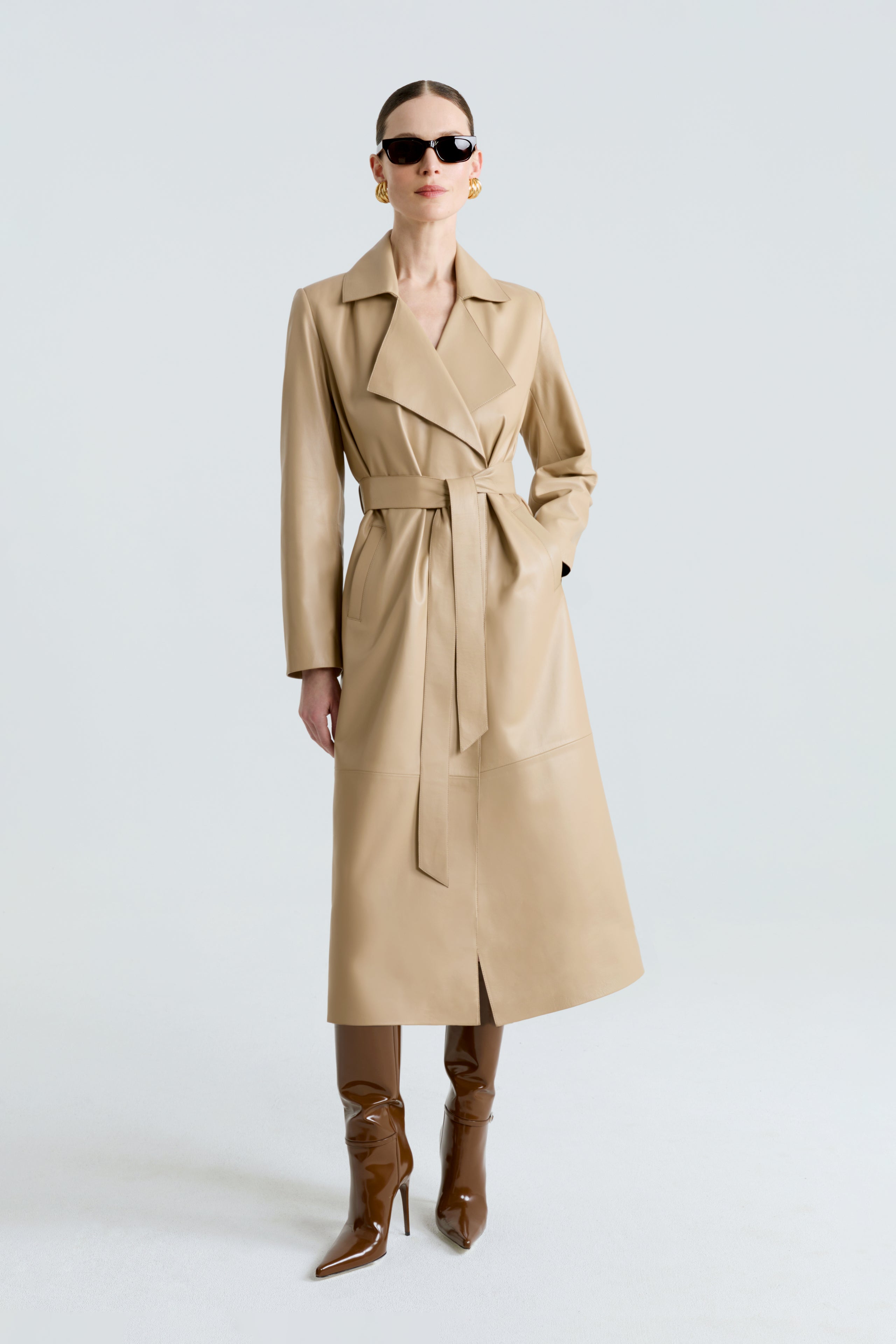 Model is wearing the Amina Beige Belted Leather Coat Front