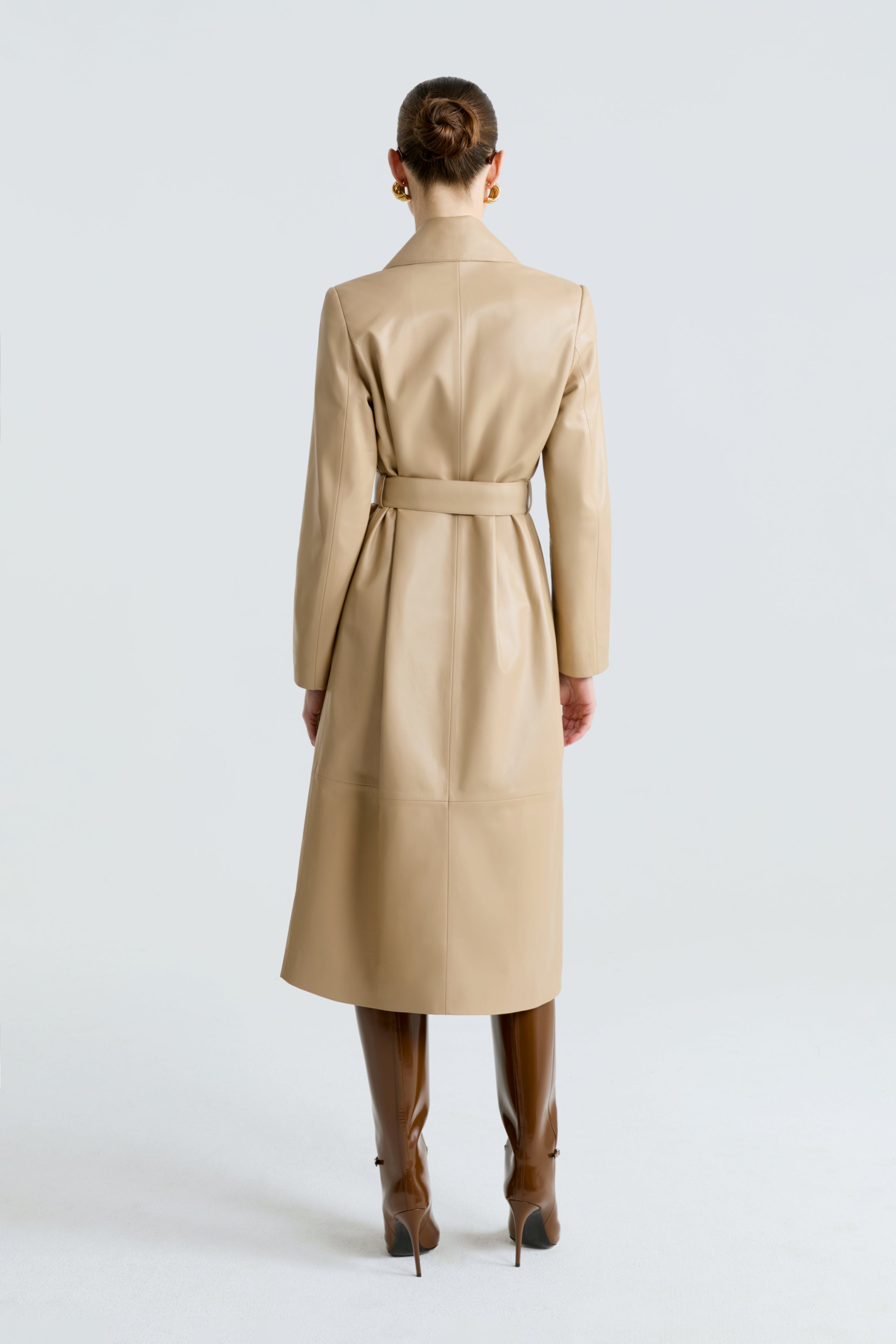 Model is wearing the Amina Ivory Belted Leather Coat Back
