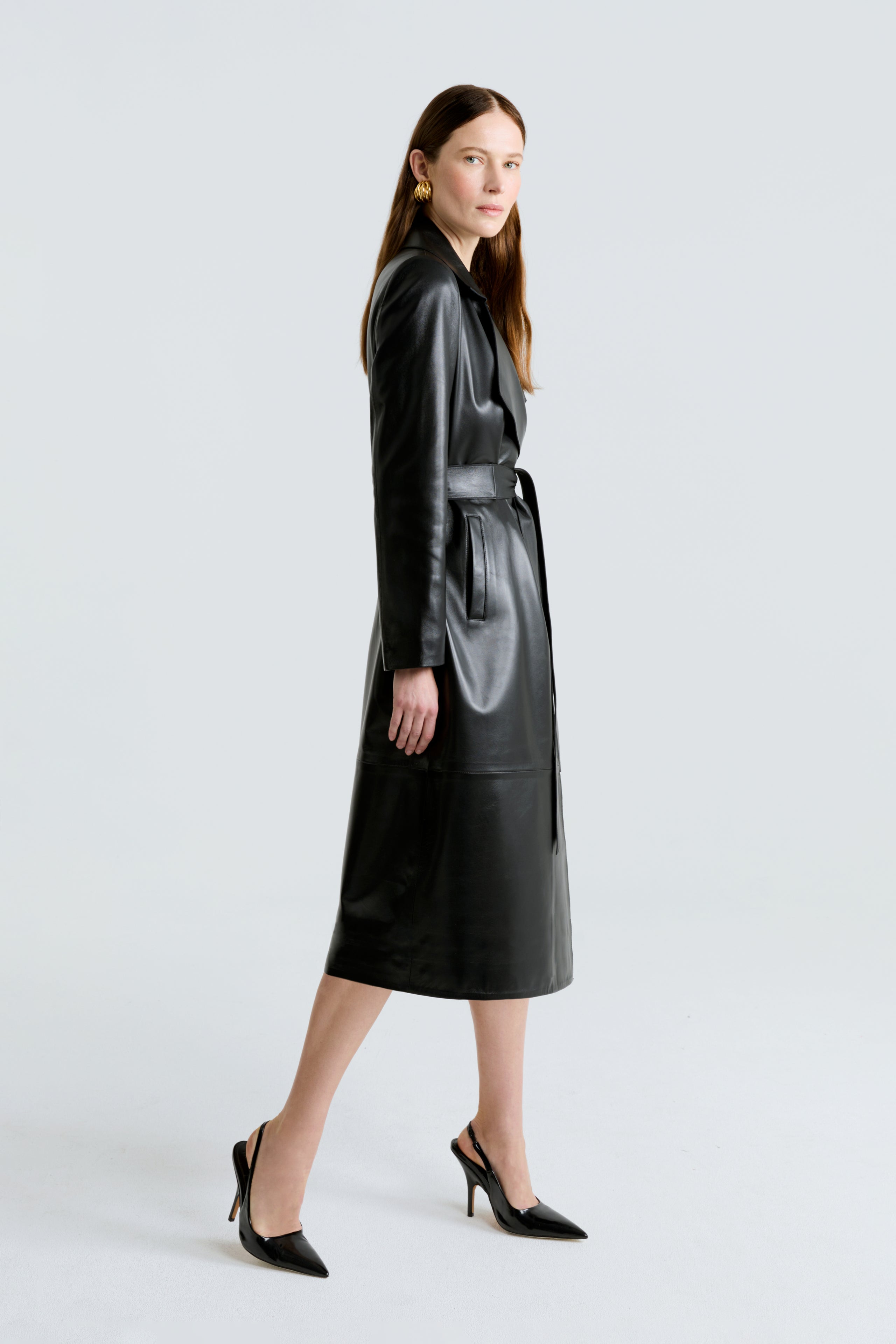 Model is wearing the Amina Black Belted Leather Coat Side