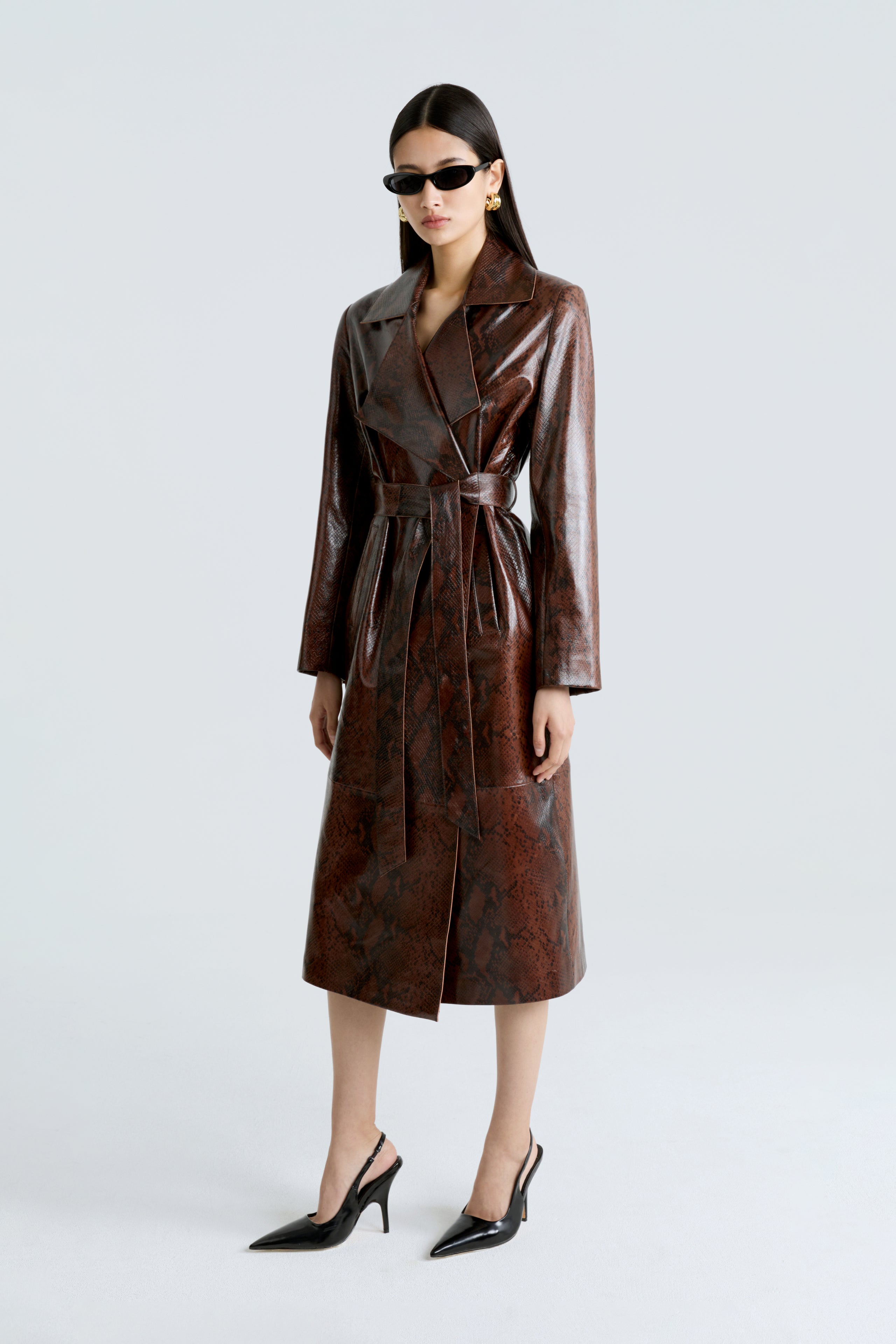 Model is wearing the Amina Python Belted Leather Coat Side