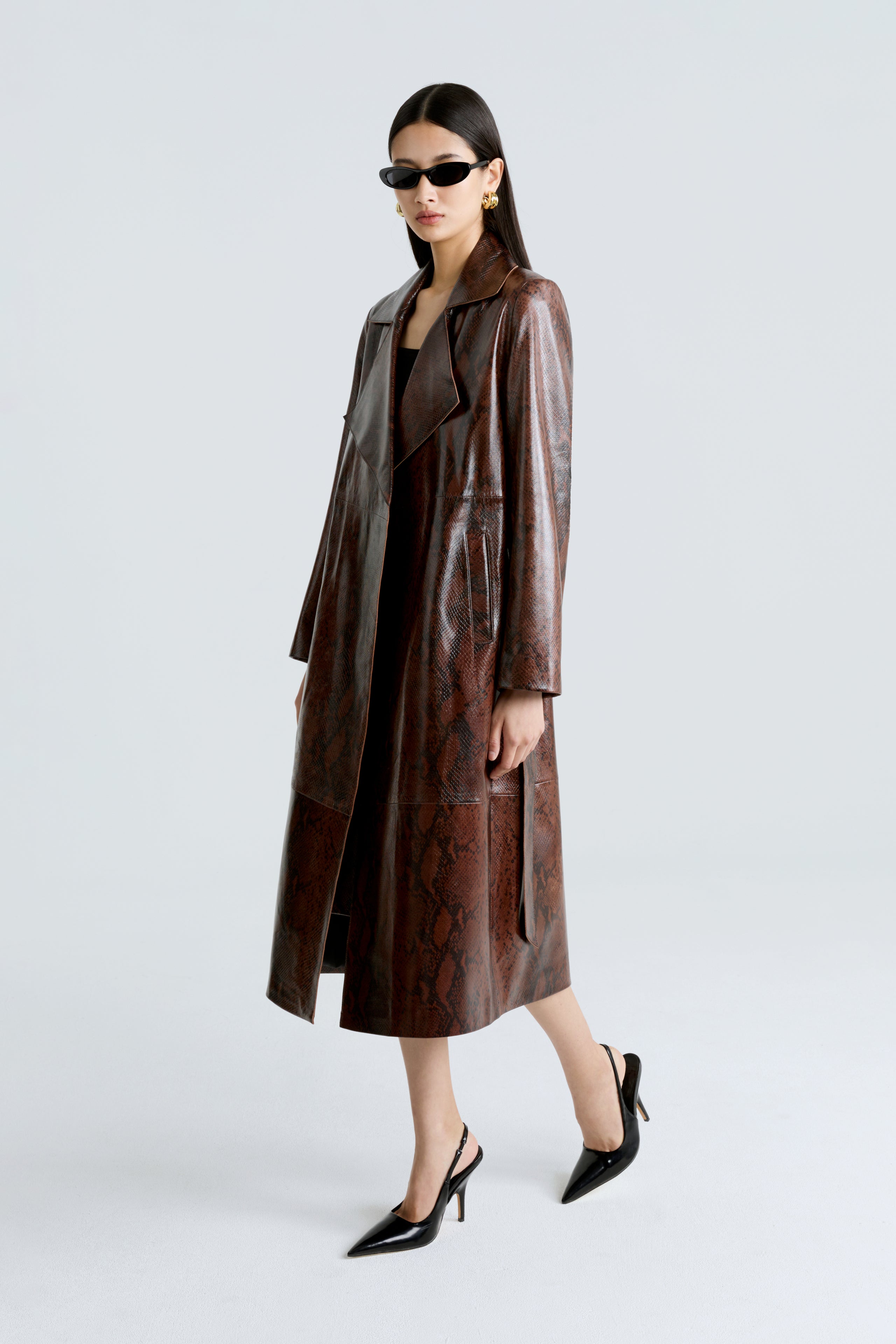 Model is wearing the Amina Python Belted Leather Coat Side