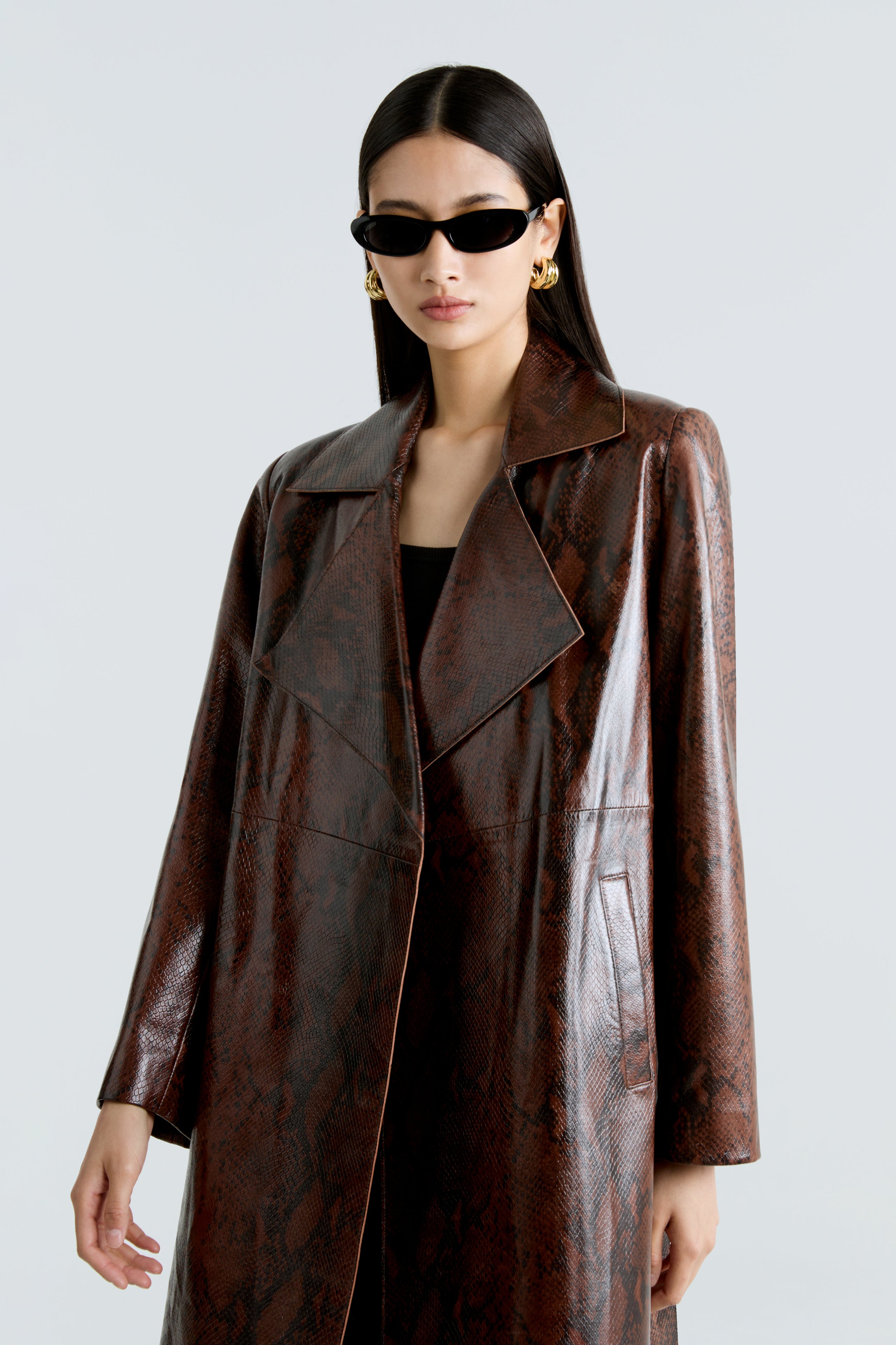 Model is wearing the Amina Python Belted Leather Coat Close Up