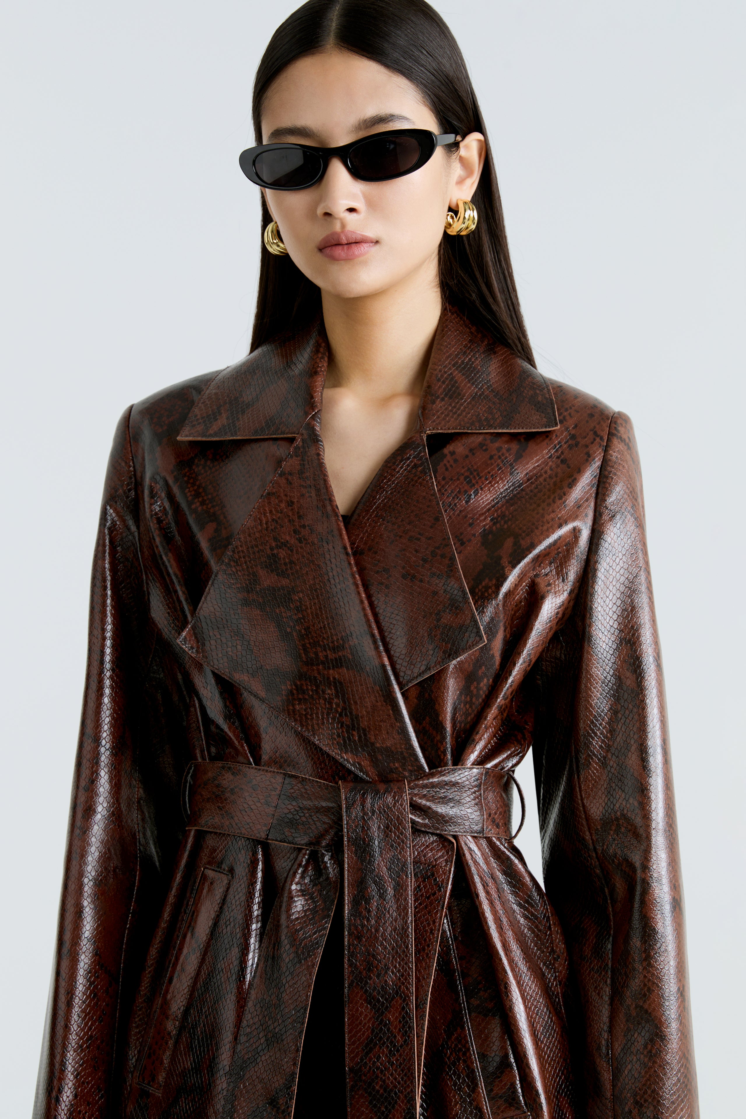 Model is wearing the Amina Python Belted Leather Coat Close Up