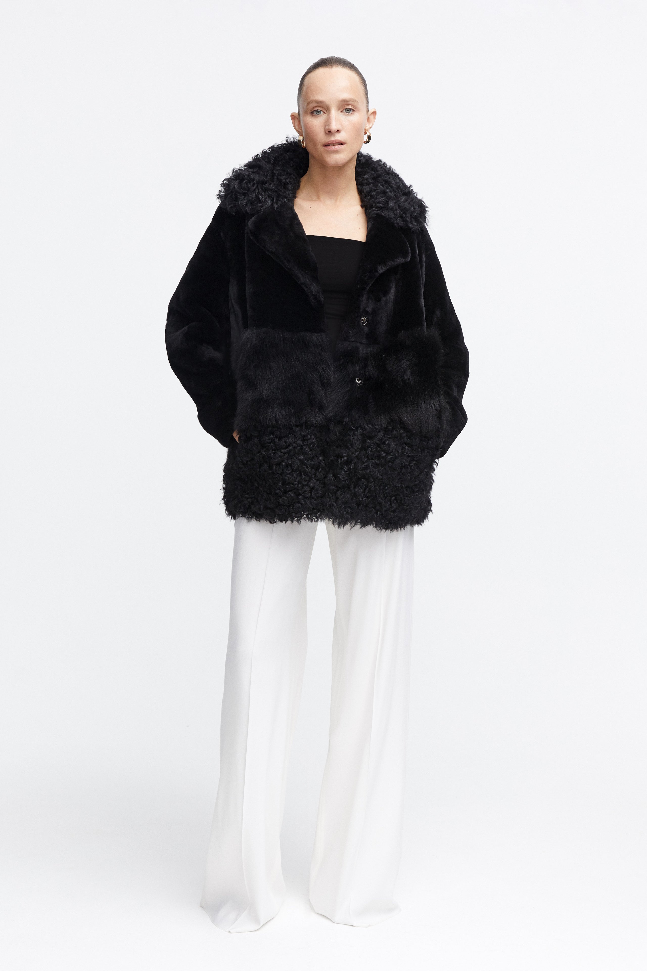 Model is wearing the Anouk Black Luxurious Shearling Coat Front