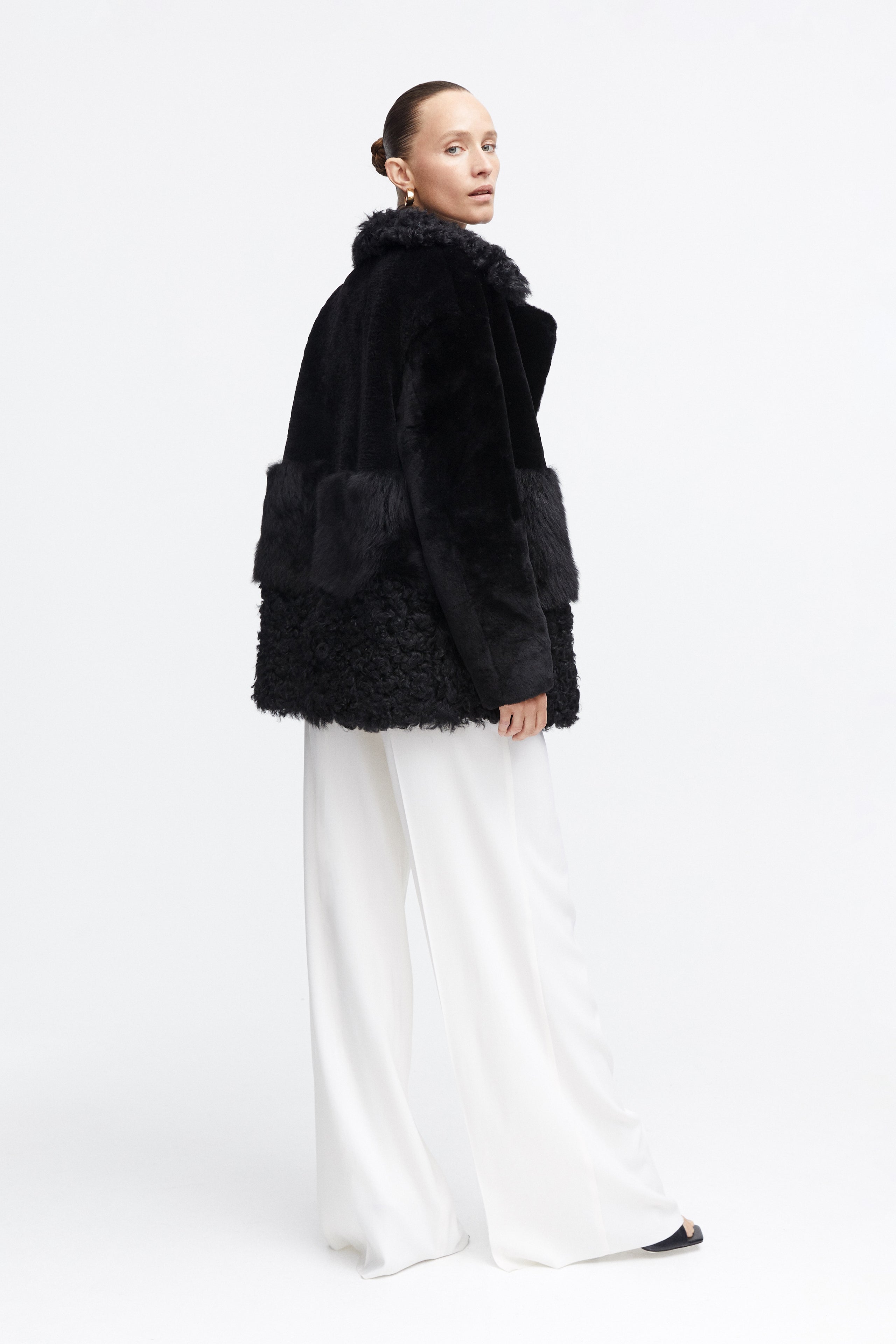 Model is wearing the Anouk Black Luxurious Shearling Coat Side