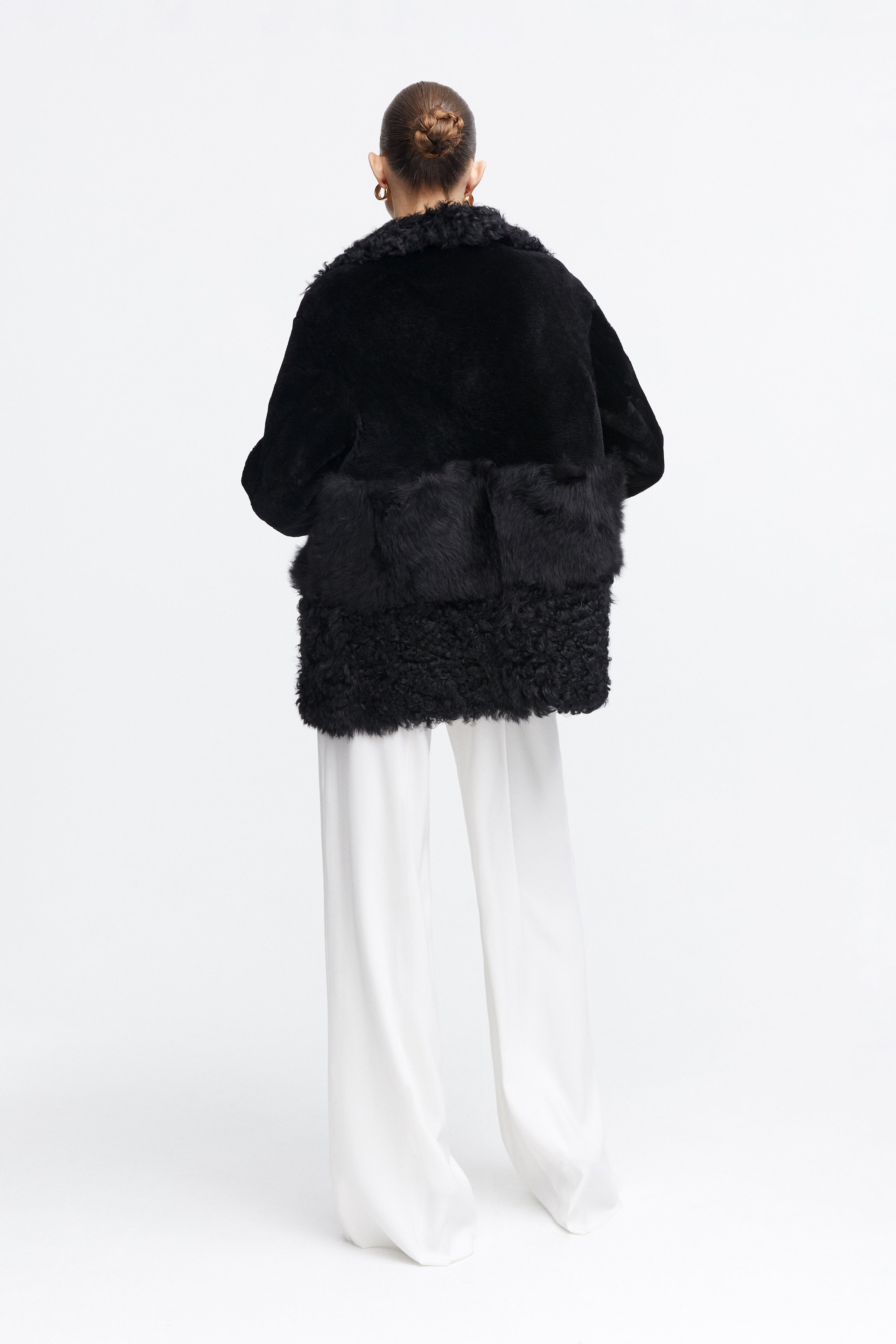 Model is wearing the Anouk Black Luxurious Shearling Coat Back