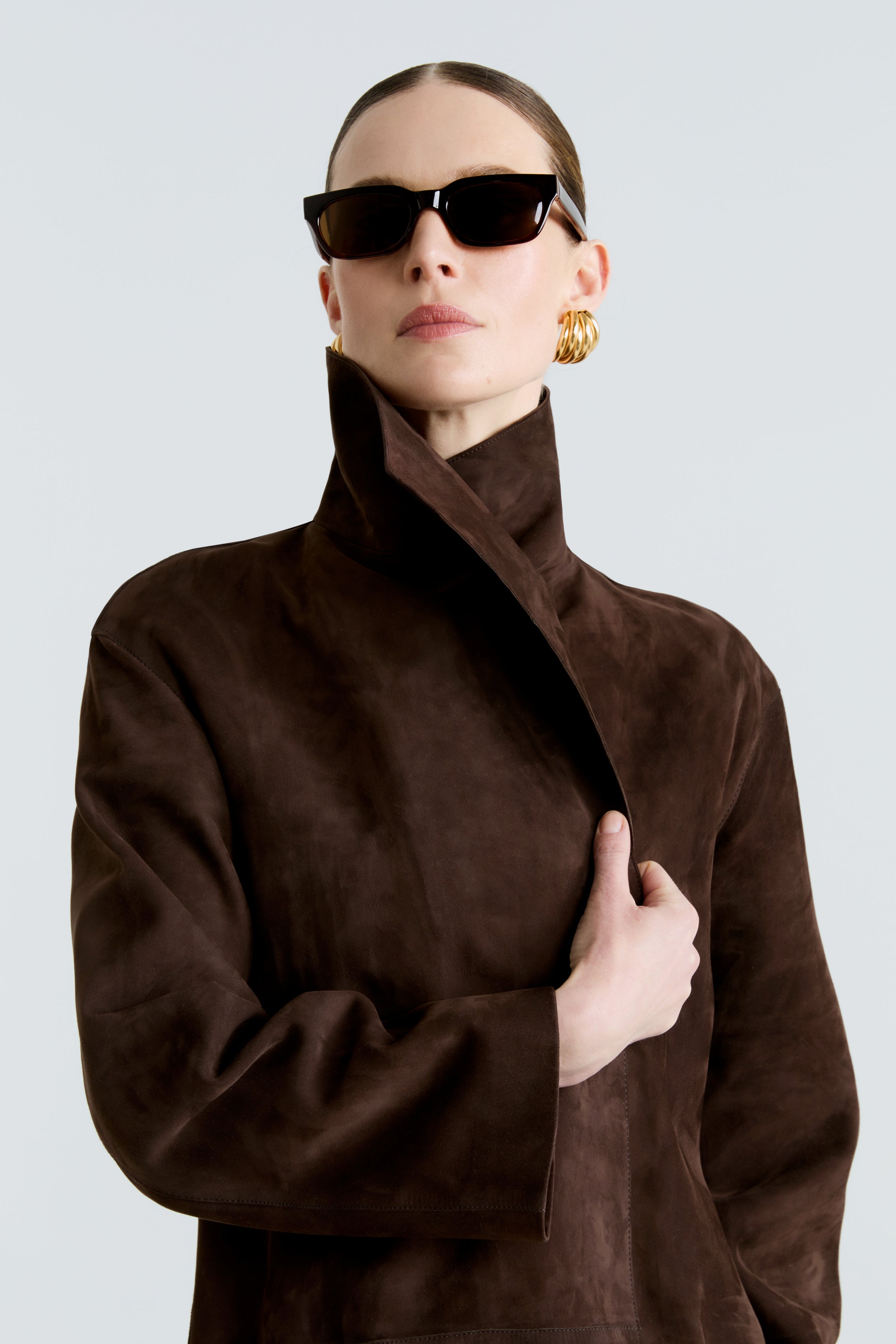 Model is wearing the Birthday Coat Suede Mocha Draped Suede Coat Close Up