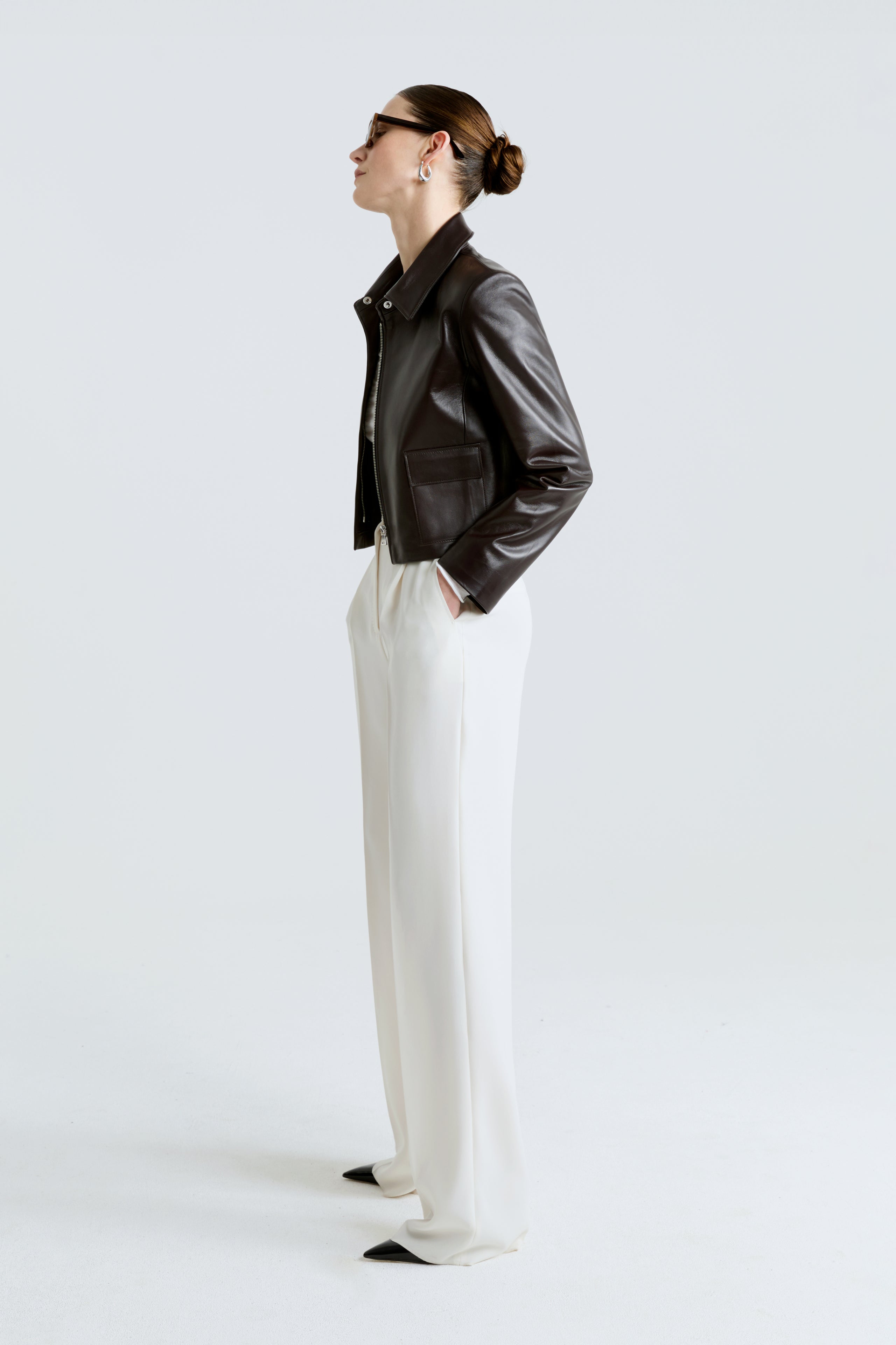 Model is wearing the Bleeker Syrup Minimalist Zip Leather Jacket Side