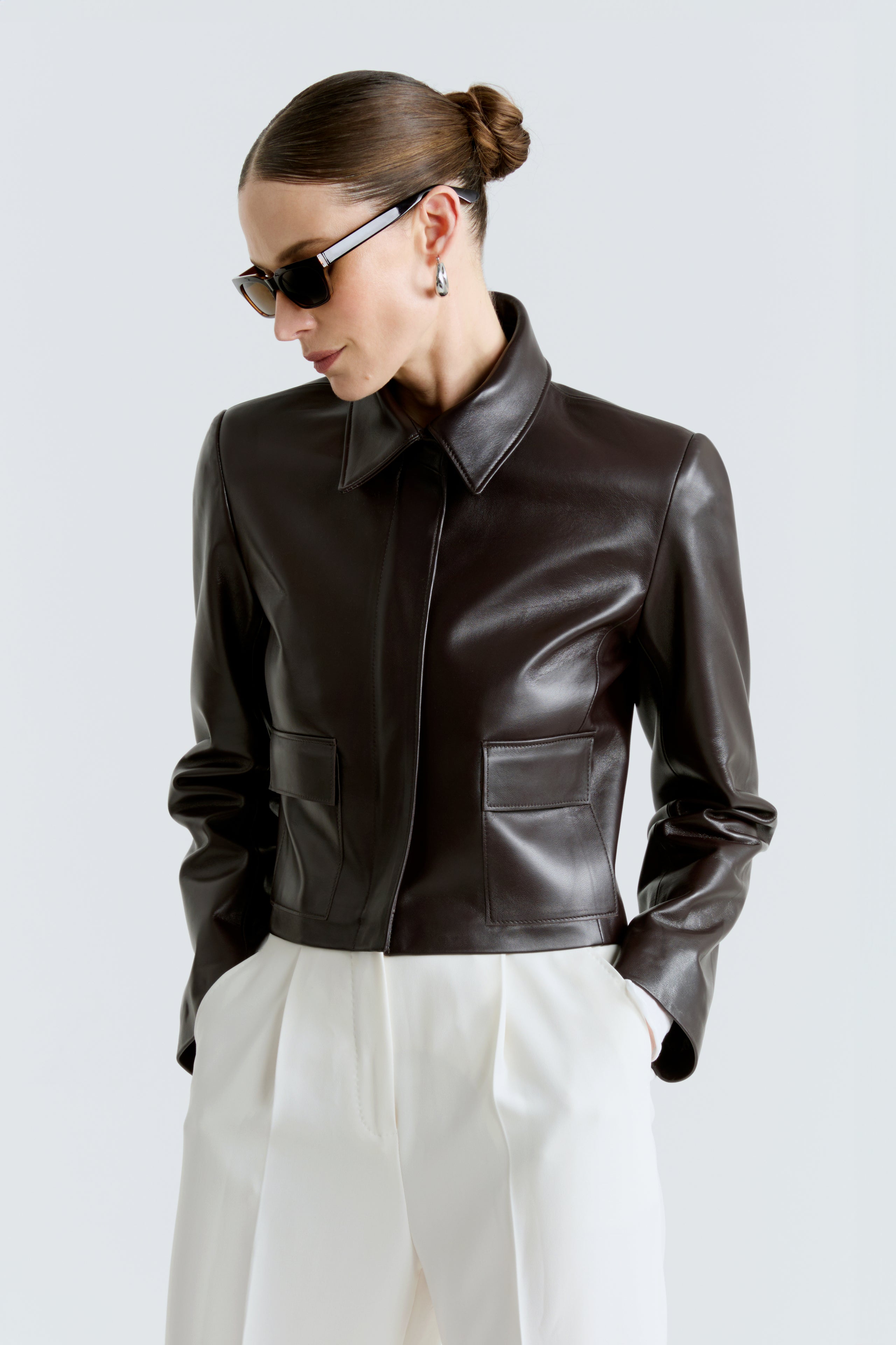 Model is wearing the Bleeker Syrup Cropped Leather Jacket Close Up
