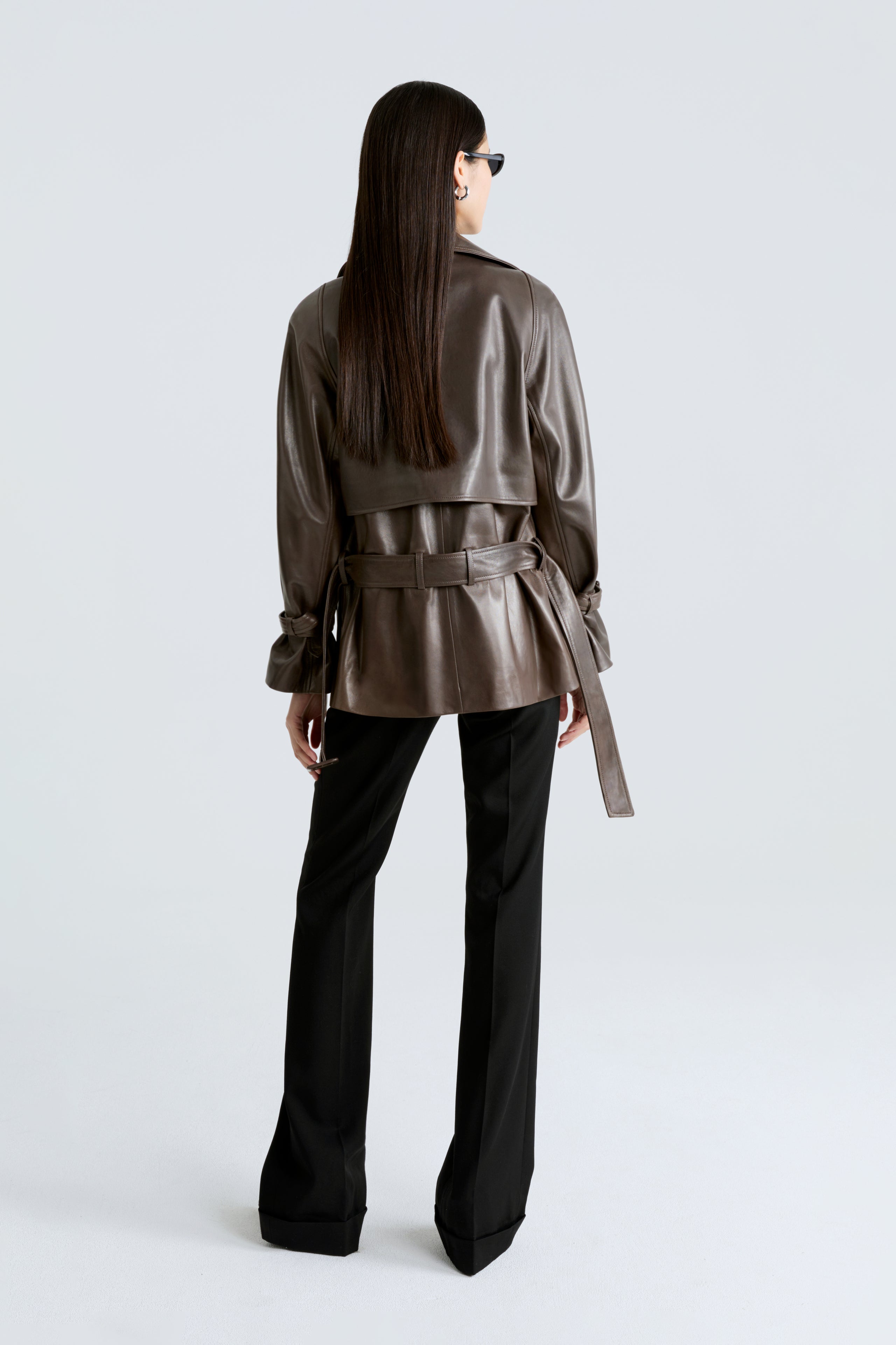 Model is wearing the Brea Truffle Belted Leather Short Trench Back