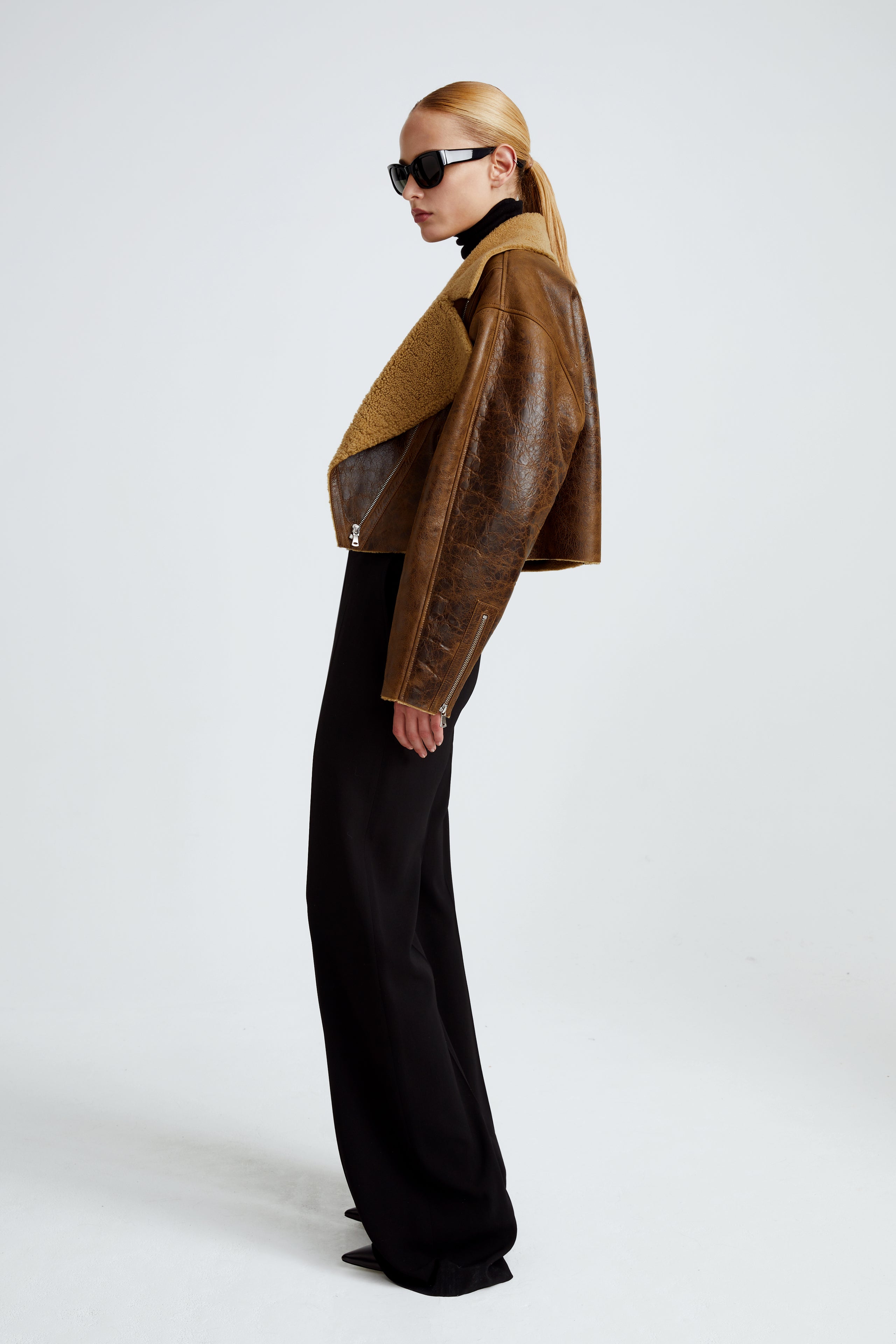 Model is wearing the Colorado Brown Caramel Relaxed Shearling Jacket Side