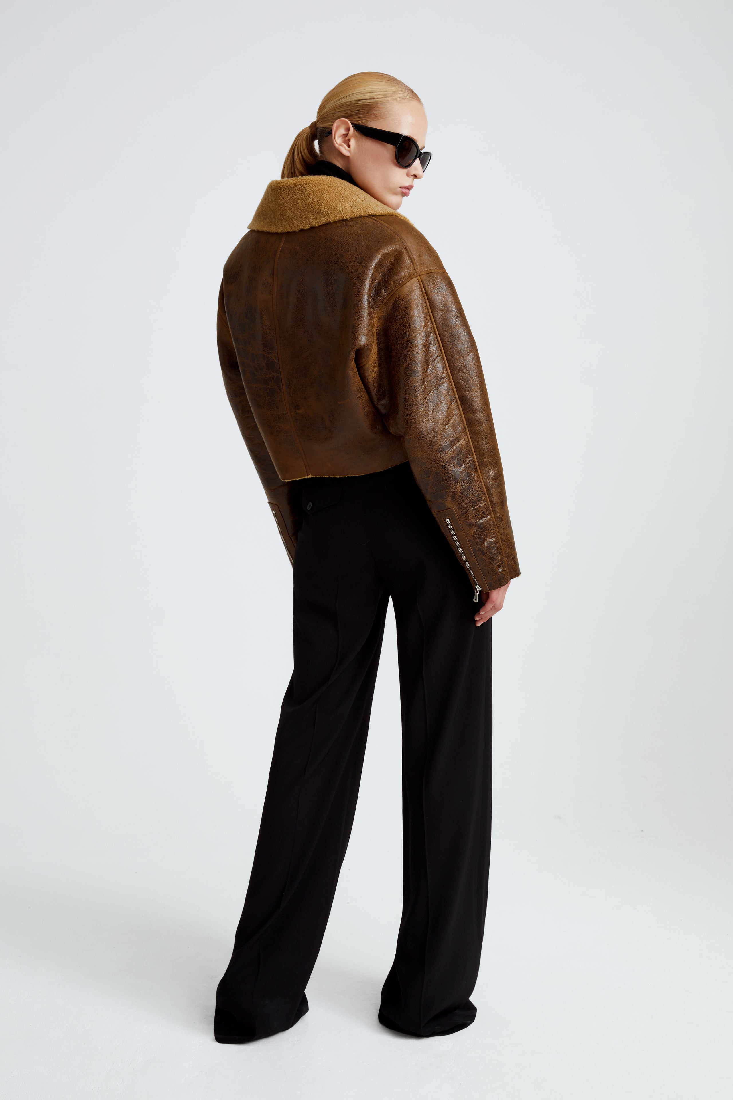 Model is wearing the Colorado Brown Caramel Relaxed Shearling Jacket Back