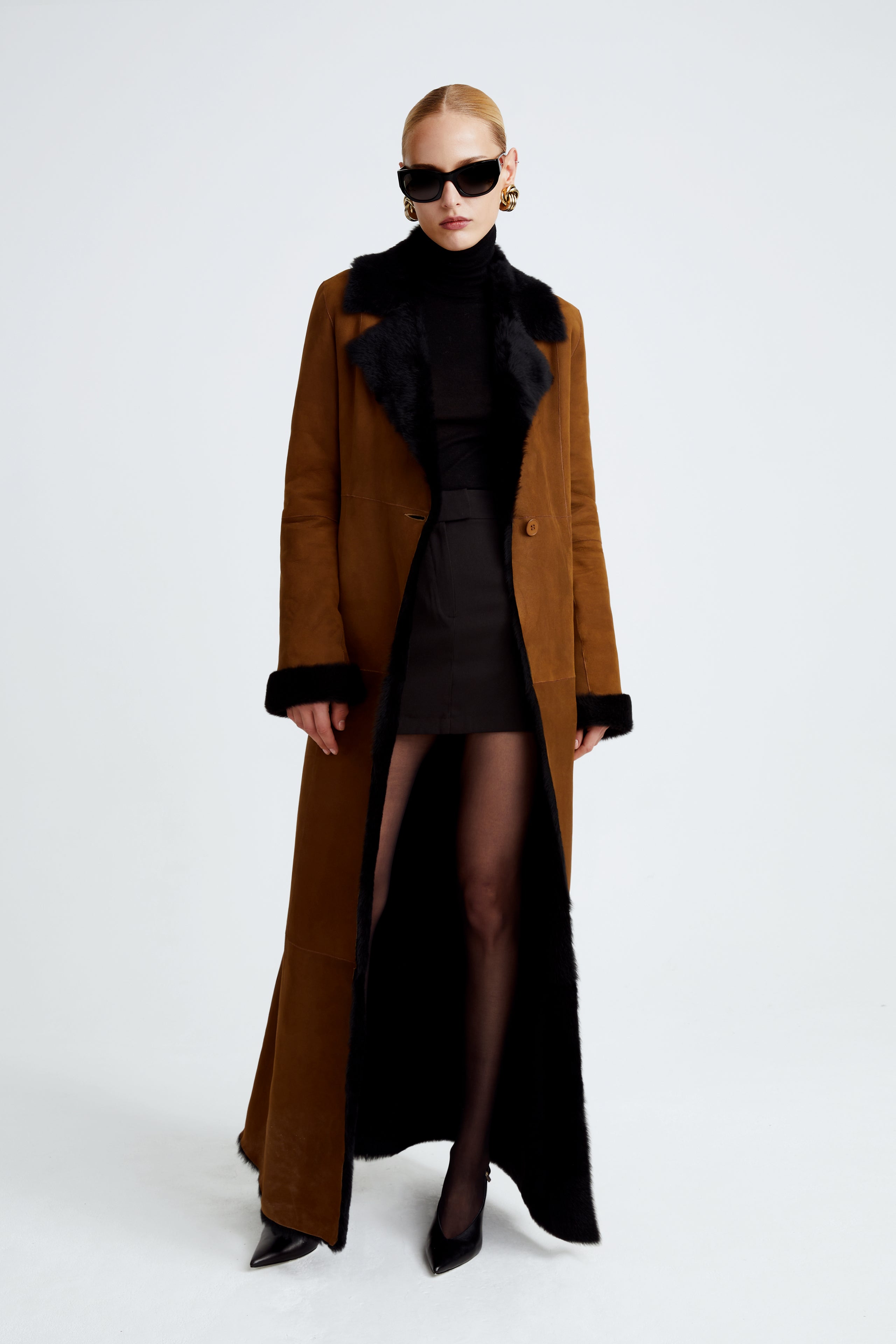 Model is wearing the Coralie Saddle Black 90s Glamour Shearling Coat Front