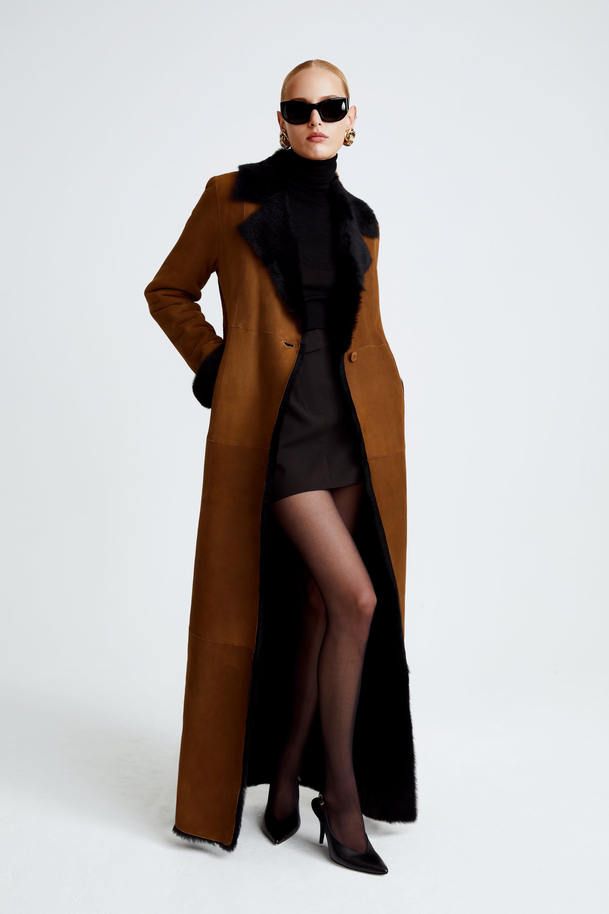 Model is wearing the Coralie Saddle Black 90s Glamour Shearling Coat Front