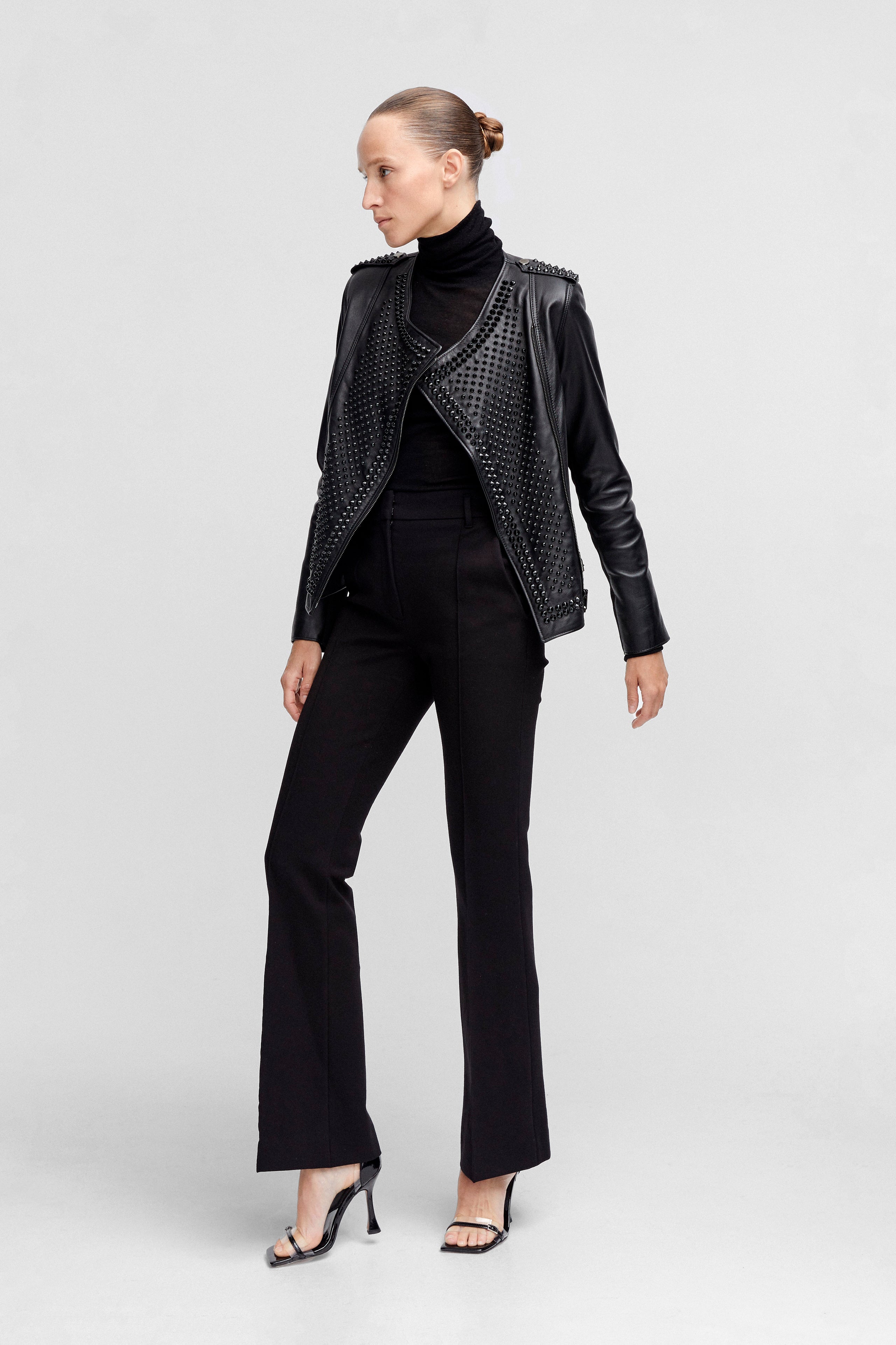 Model is wearing the Erin Black Studded Leather Jacket Side