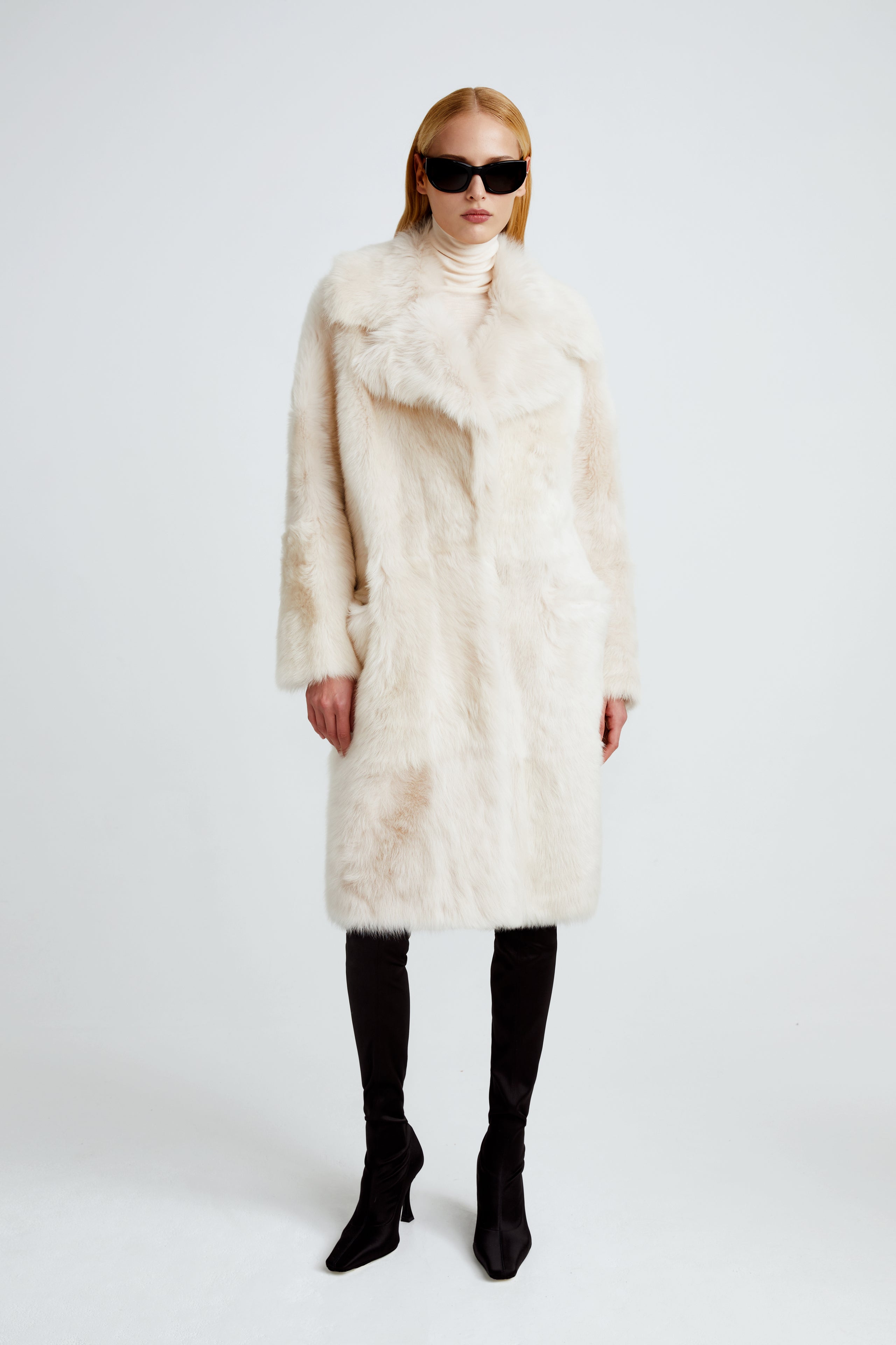 Model is wearing the Evita Cloud Après-Ski Shearling Coat Front